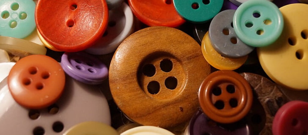 pile of buttons in different sizes and colors