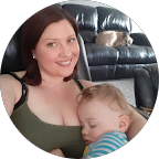 Google profile image of Kimberley Brothers; a smiling young woman holding a sleeping toddler.