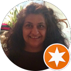 A profile portrait of Fanar Azzou smiling broadly and looking directly at the camera. She has long dark curly hair and is wearing a dark shirt.